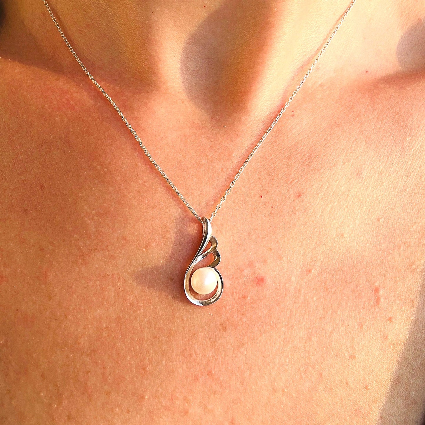 Silver Pearl Necklace featuring Delicate Angel Wings Design