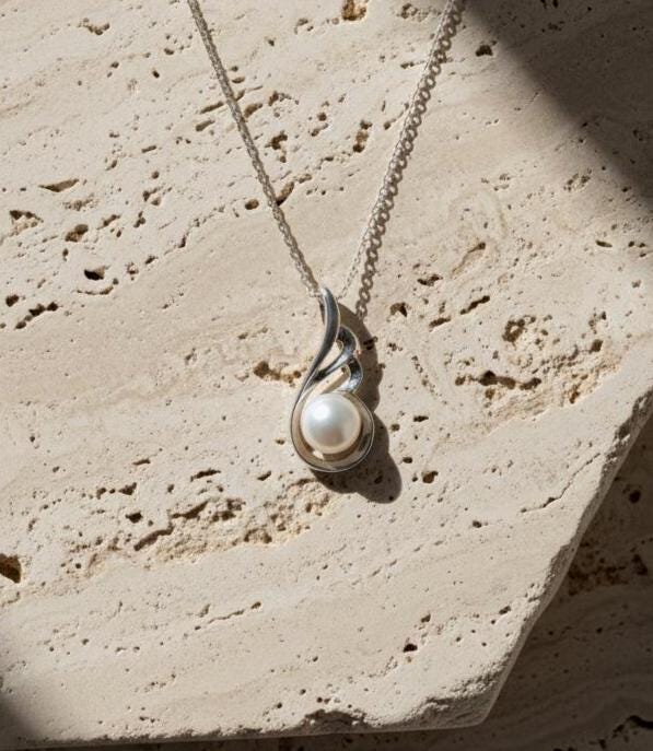 Silver Pearl Necklace featuring Delicate Angel Wings Design