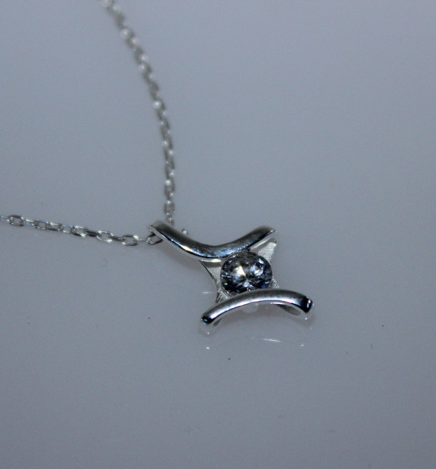 Camelia Cross and Solitaire Necklace